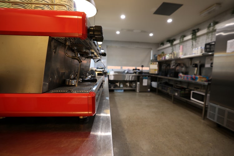 A photo of our cafe with a coffee machine.